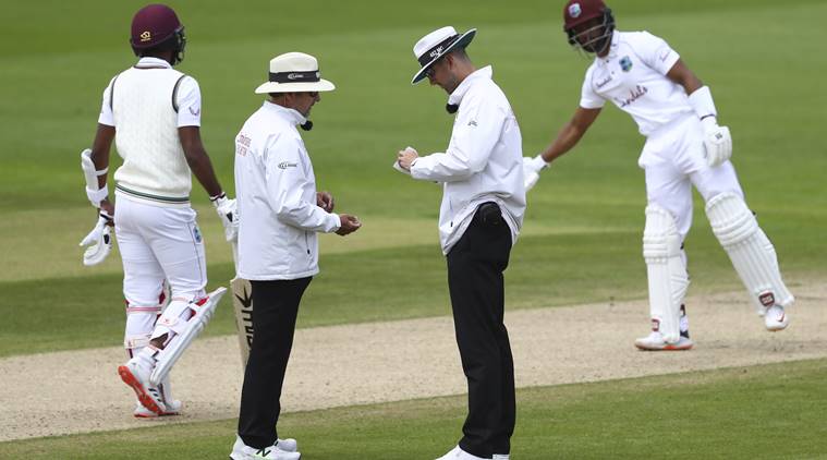 Umpire sanitizing ball England vs West Indies